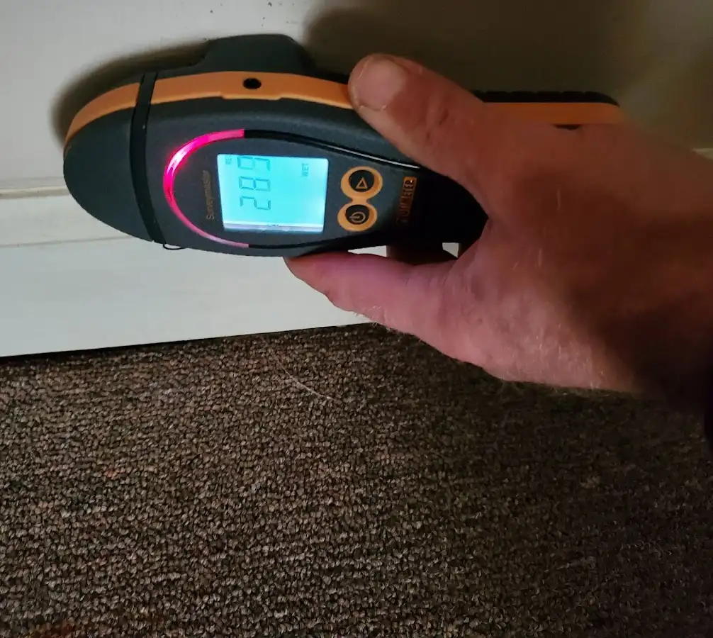 Moisture detection at baseboard during Burst Pipe Cleanup in Manchester